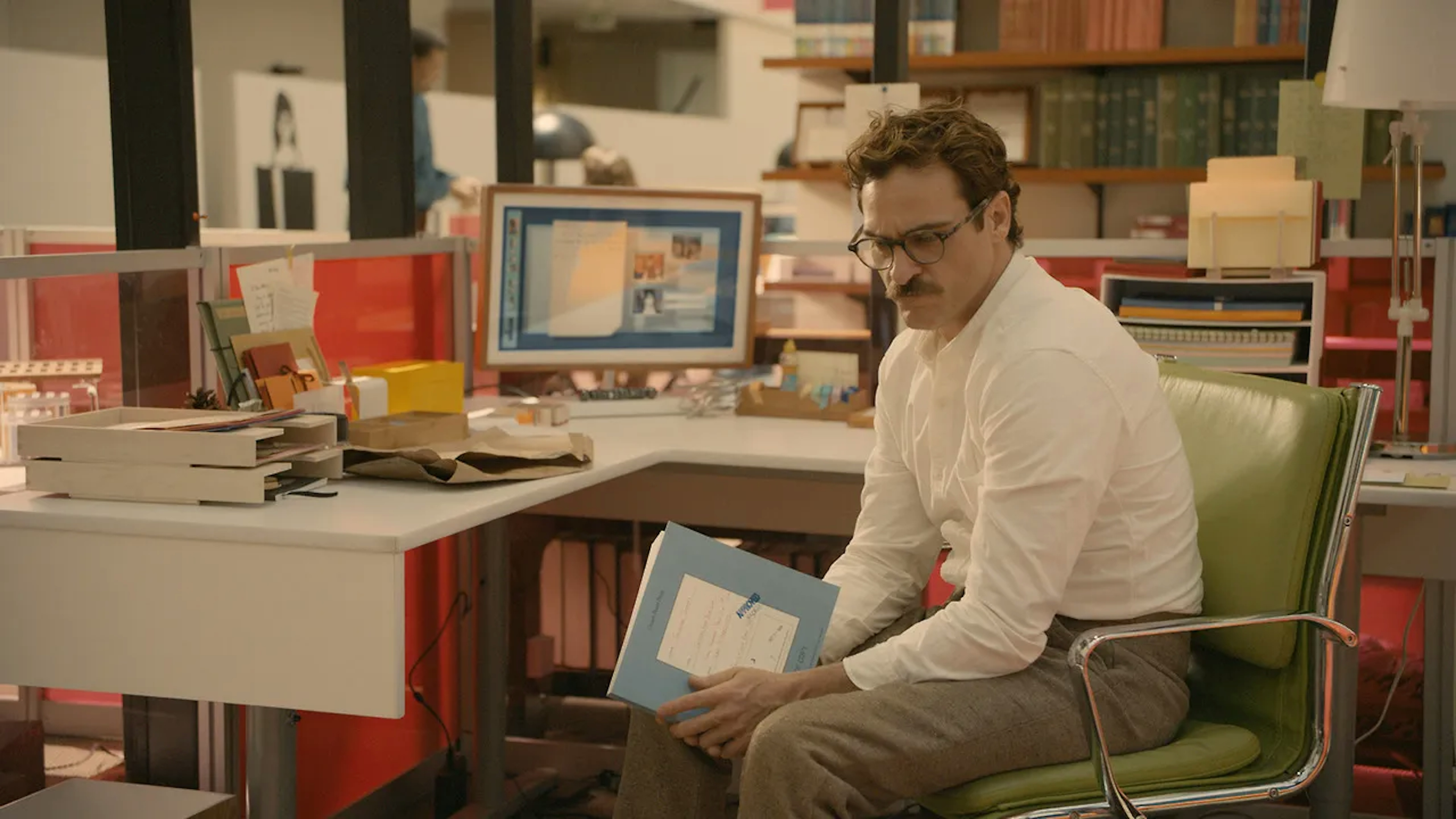 An shot from the movie Her, showing the protagonist interacting with his AI assistant
